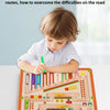 A child is playing with a wooden magnetic color and number maze toy designed for counting and fine motor skills.