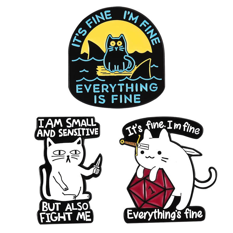Four enamel pins featuring cats with text like It's fine I'm fine and Everything is fine