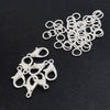 A collection of gold and silver lobster clasps and open jump rings for jewelry making.