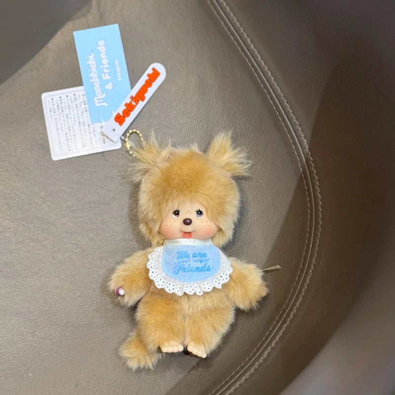 A fluffy orange bear plush toy with a blue heart decoration is shown against a neutral background.