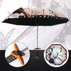 A black umbrella featuring a Demon Slayer theme with butterfly and floral patterns.