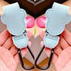 Light blue stroller organizer hooks with PU leather material shown being held by a hand