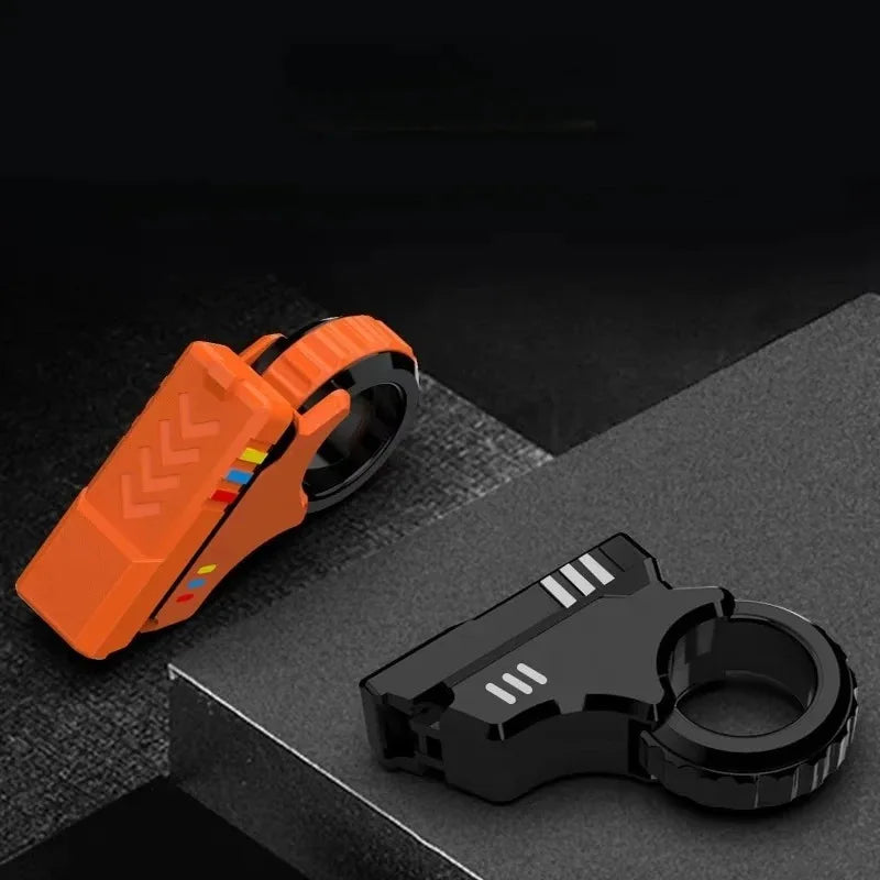 An orange magnetic fidget push card with a spinner is shown on a dark surface.