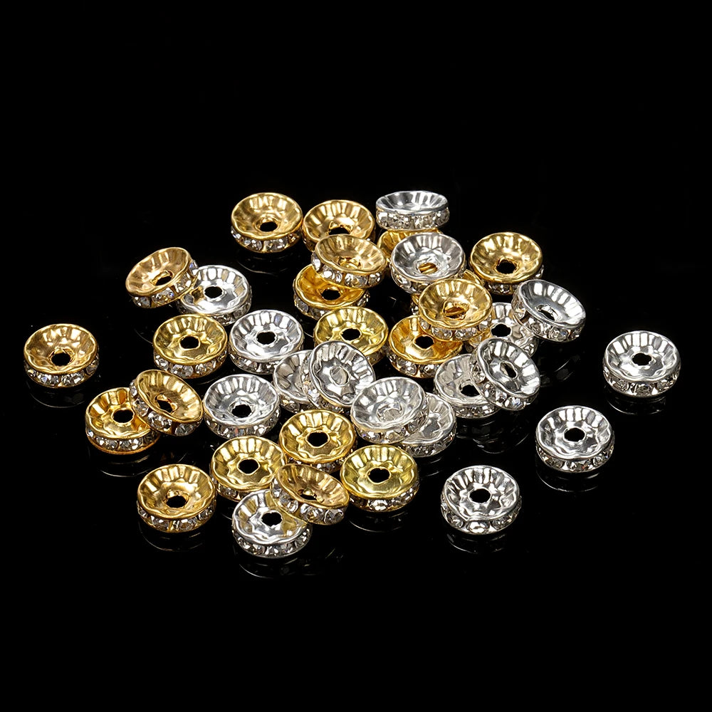 A collection of gold and silver crystal rondelle spacer beads for jewelry making
