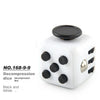A white die with black dots, labeled as a decompression die.