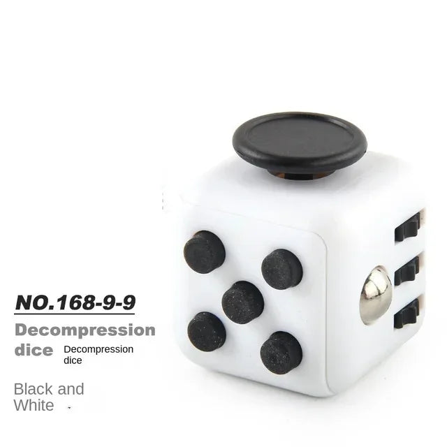 A white die with black dots, labeled as a decompression die.