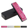 A pink harmonica with ten holes and a black case is shown, along with several other harmonica models.