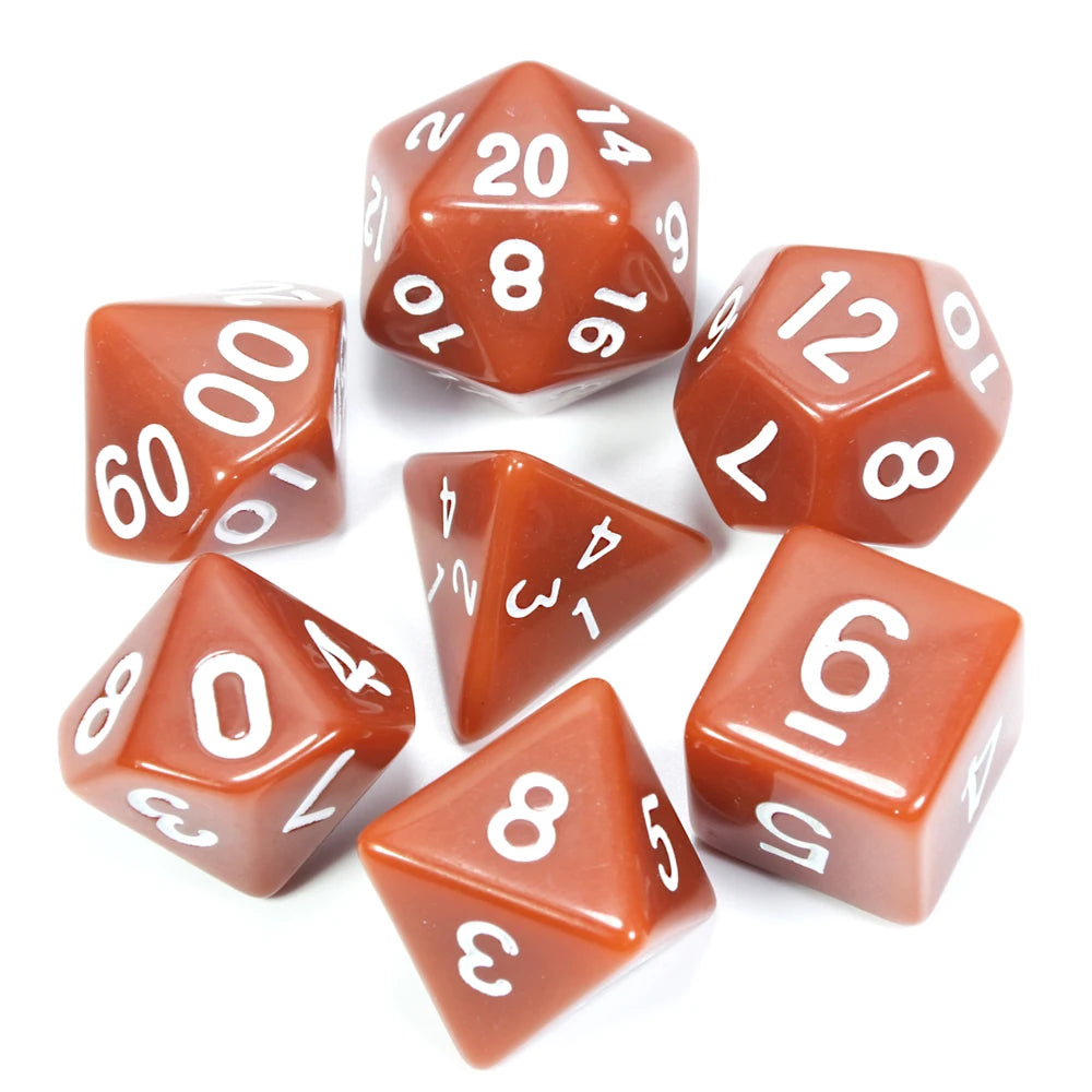 A collection of red acrylic dice showing various numbers and shapes used for tabletop role-playing games