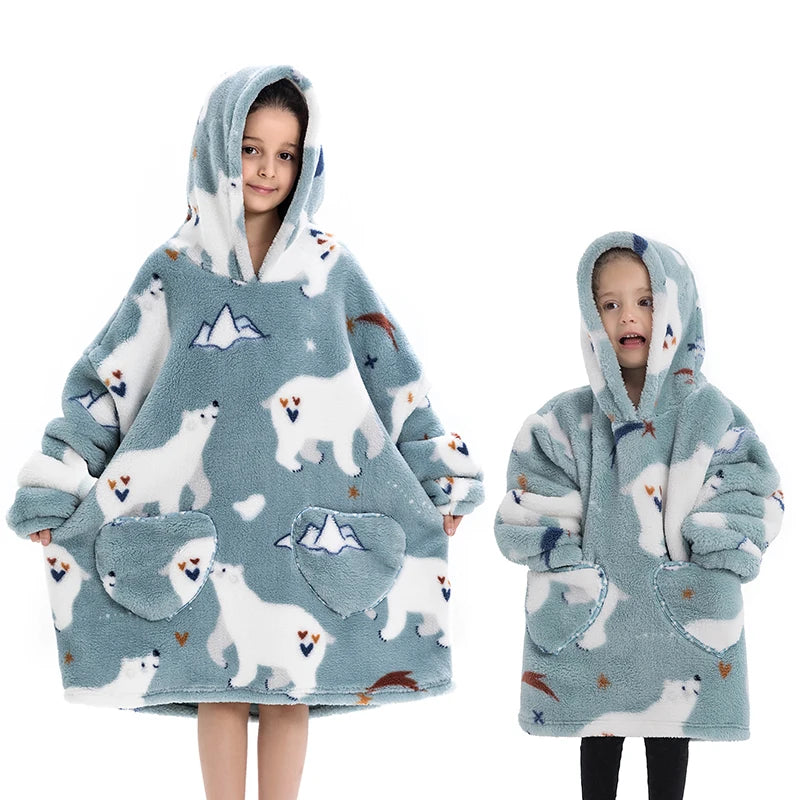 A young girl models a light blue and white fluffy hoodie sweater with a hood and pockets.