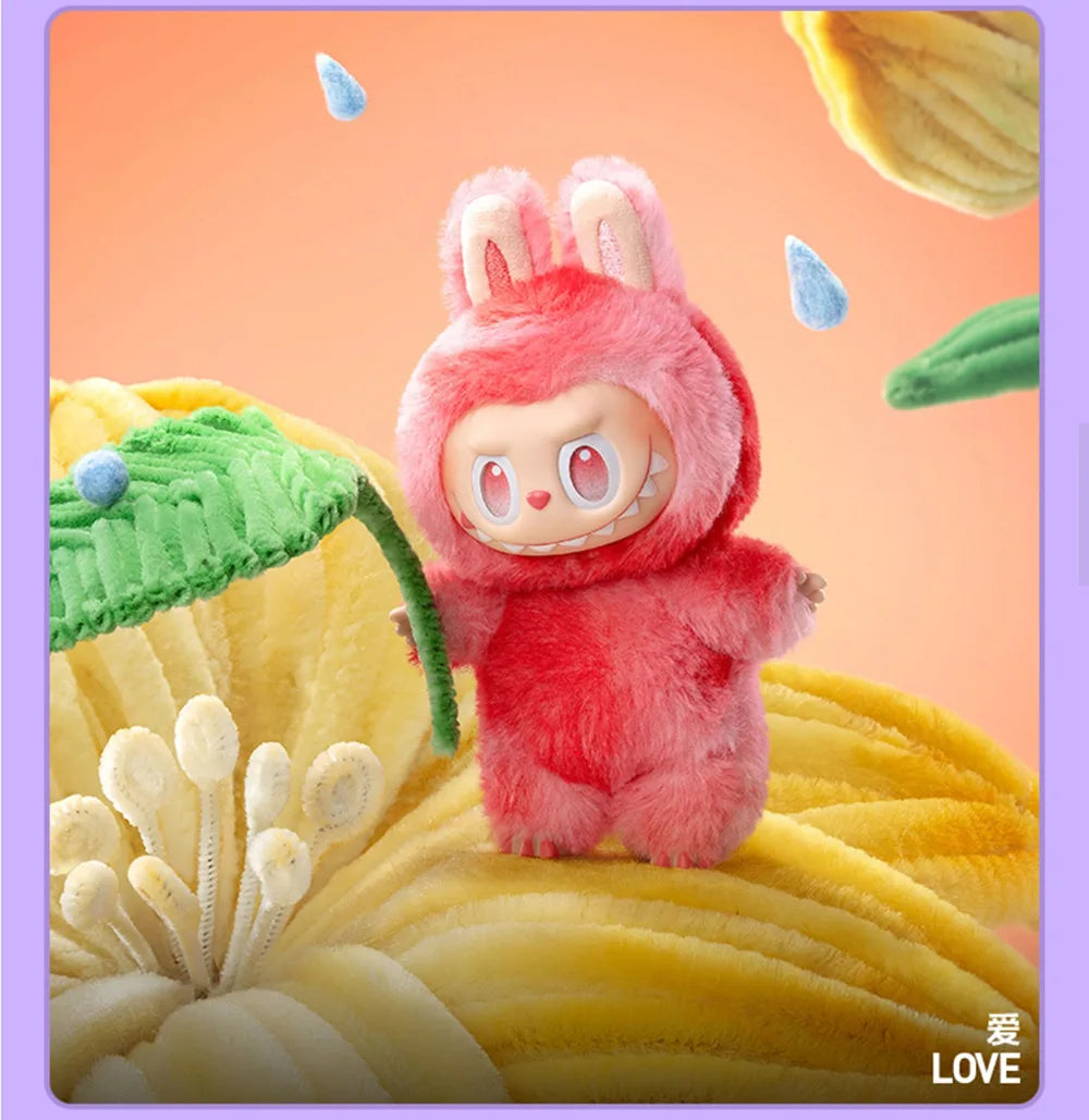 A pink Labubu 3.0 Big Into Energy collectible plush doll with large ears is featured against a yellow textured background.