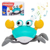 A bright blue and yellow interactive music crab toy with large eyes and claws is shown against a white background.