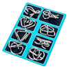 A blue plastic tray holding eight metal brain teaser puzzle pieces.