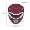A red and white enamel pin featuring a dinosaur ranger battle suit and helmet design.