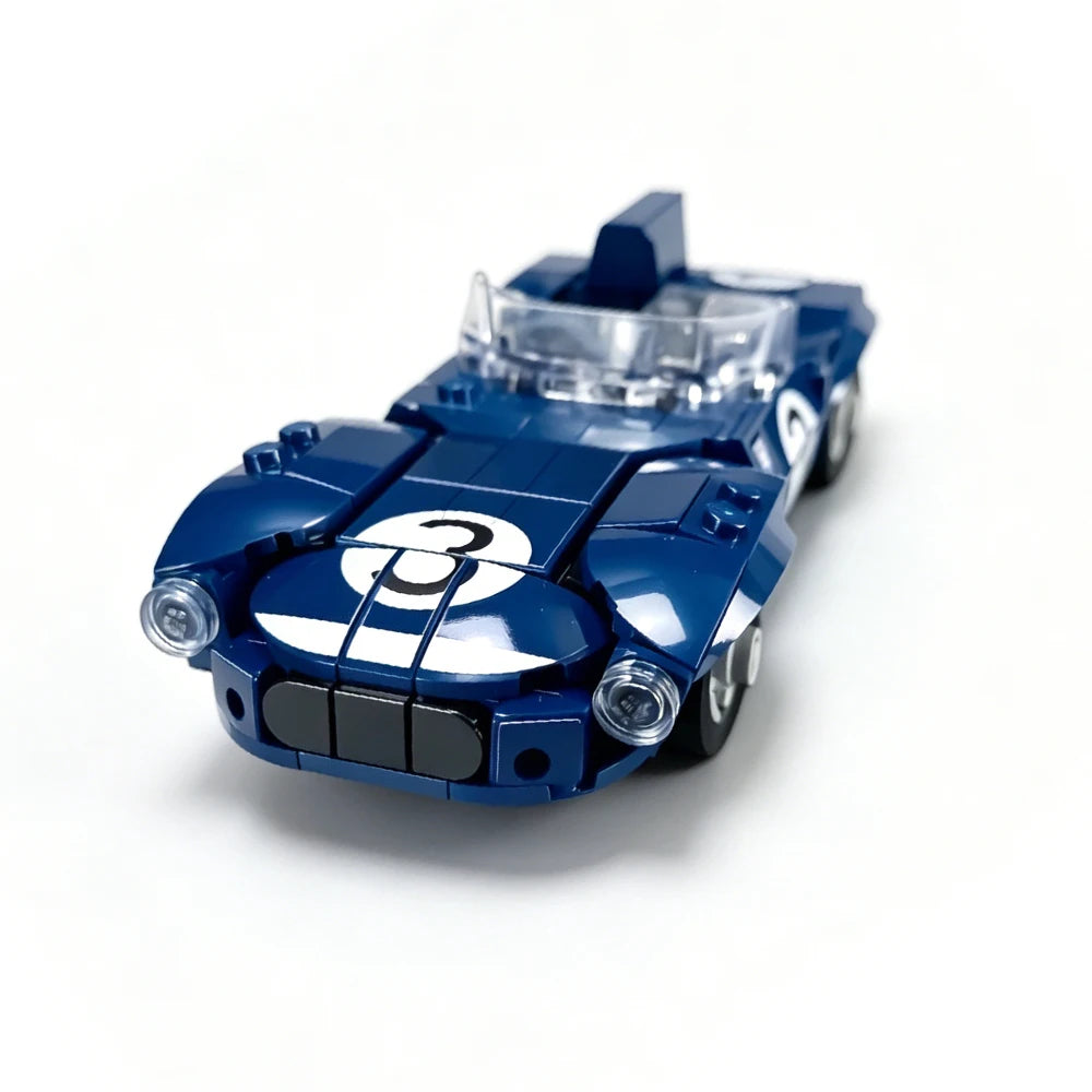 A blue Le Mans Raceway building block set featuring a race car model with headlights and a number 3.