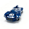A blue Le Mans Raceway building block set featuring a race car model with headlights and a number 3.