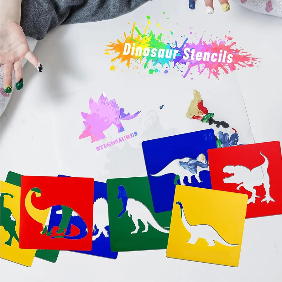 A collection of colorful dinosaur stencils and paint palettes laid out on a white surface.