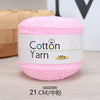 Pink cotton yarn in a spool, labeled as 100% cotton yarn for knitting and crochet.