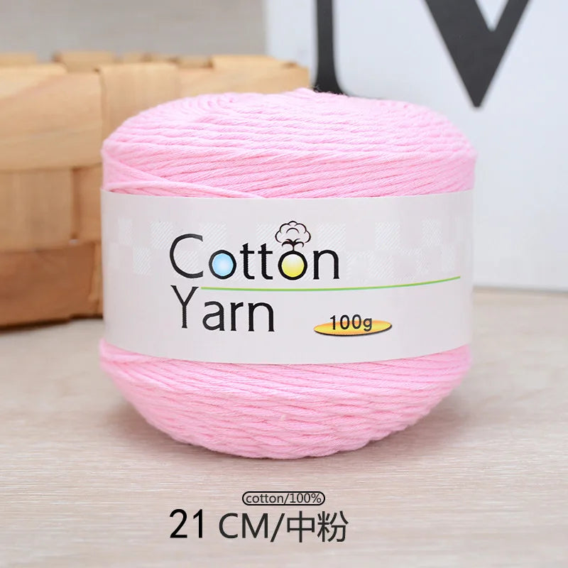 Pink cotton yarn in a spool, labeled as 100% cotton yarn for knitting and crochet.