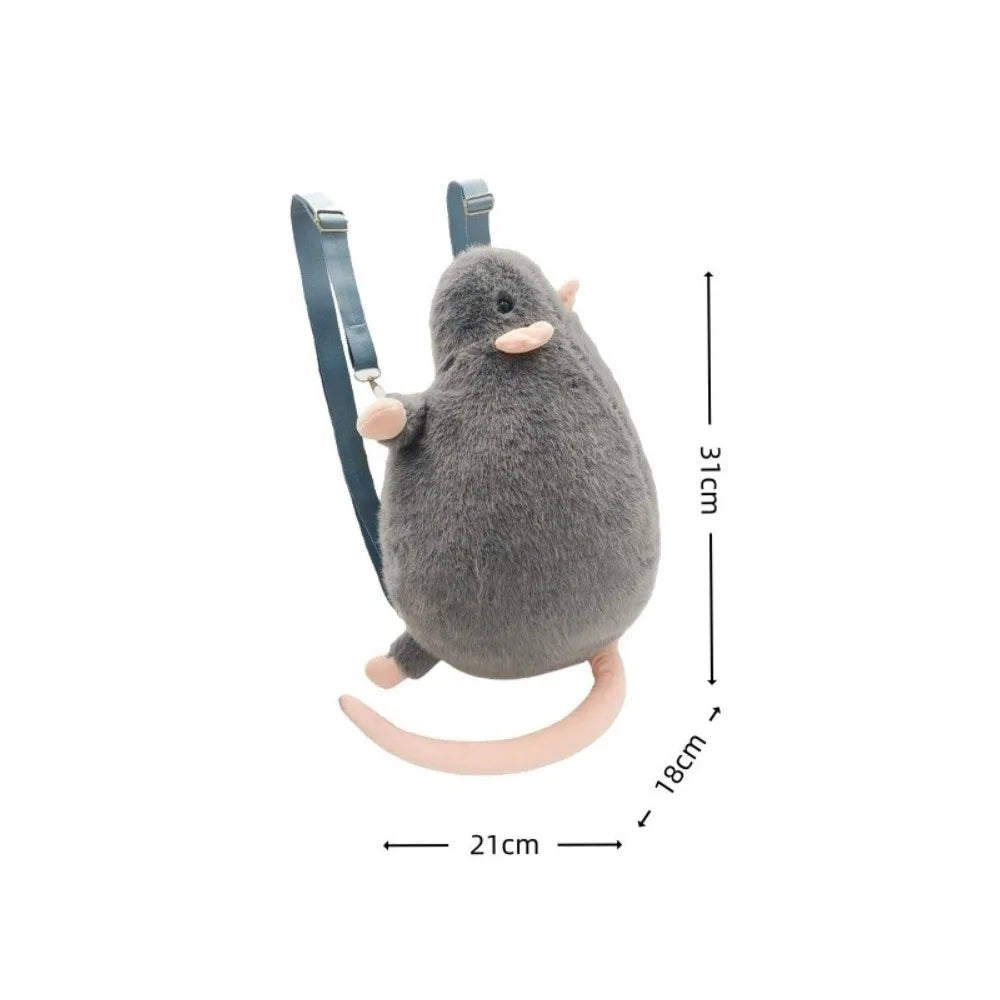 A gray mouse plush toy with a backpack strap, shown from the side.