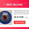 A spool of 300G/Ball Mercerized Organic Cotton Gradient Yarn in blue and pink for knitting or crochet projects.