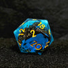 A translucent blue resin die with numbers on its faces resting on a dark surface.