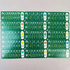 A collection of compact strategy board game cards featuring numbered tiles and symbols for family game night.