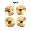 Four gold-colored mini copper finger cymbals used for belly dance and percussion.