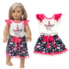 A doll outfit set featuring a white top, black skirt with pink trim, and matching tights.