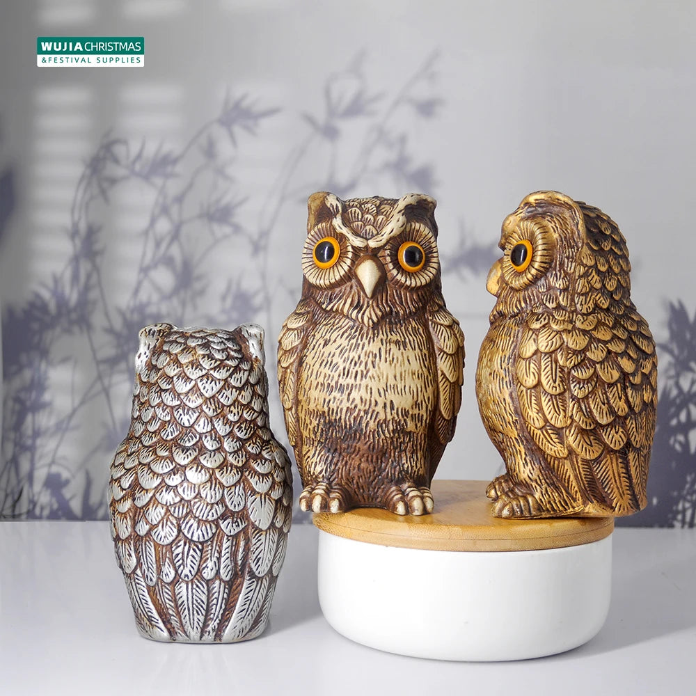 A realistic owl garden statue bird deterrent decor made of textured ceramic sits on a white wooden base.