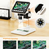 A portable digital microscope with a screen and light source is shown on a white base.