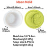 A silicone moon mold used for making candles or soap, shown next to the finished yellow moon-shaped product.