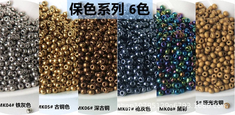 A display of six colors of electroplated metallic glass beads for jewelry and crafting.