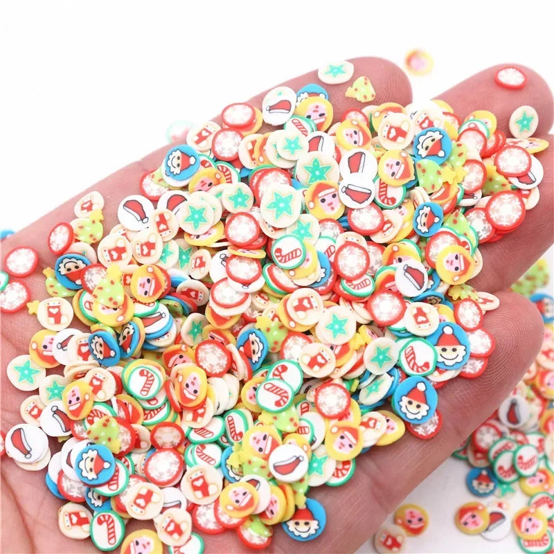 A hand holds a large pile of colorful polymer clay slices for DIY crafts