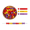 A wooden bowl filled with silicone round beads in various colors including scarlet red, yellow, and purple.