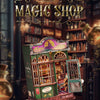 A detailed diorama of a magic shop featuring an ornate wooden miniature book nook kit for dollhouse display.