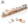 A wooden train set with numbered cars in various pastel colors, used as a Montessori educational toy for toddlers.