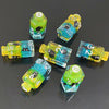 A collection of seven floral resin potion bottle polyhedral dice set in various shades of green and yellow.