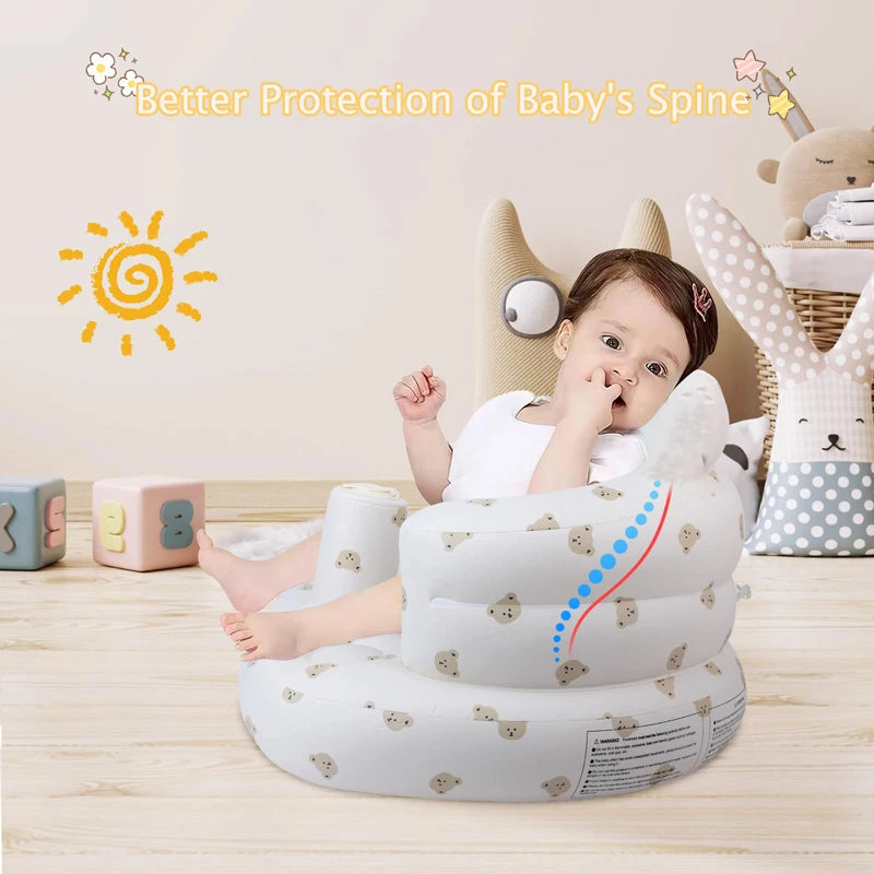 A white inflatable baby sofa designed for better protection of a baby's spine, shown on a wooden surface.