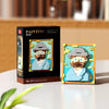 A box and assembled model of a man in a hat made from pixel art building blocks.