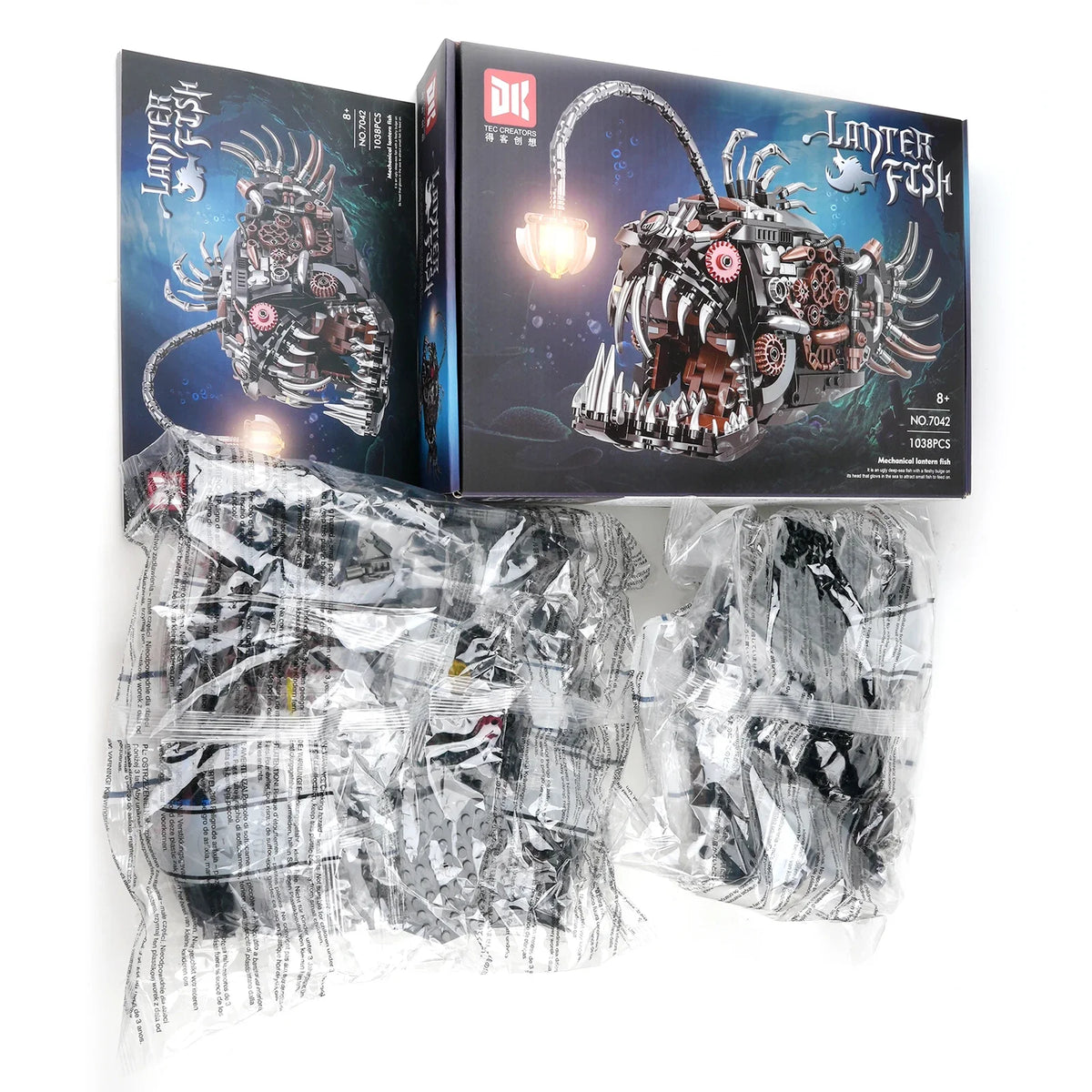 A box and plastic bags containing a mechanical lantern fish building set model kit.