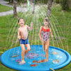 Two children are playing in a blue inflatable sprinkler play mat outdoors.