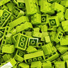 A pile of bright lime green building blocks for creative DIY projects.
