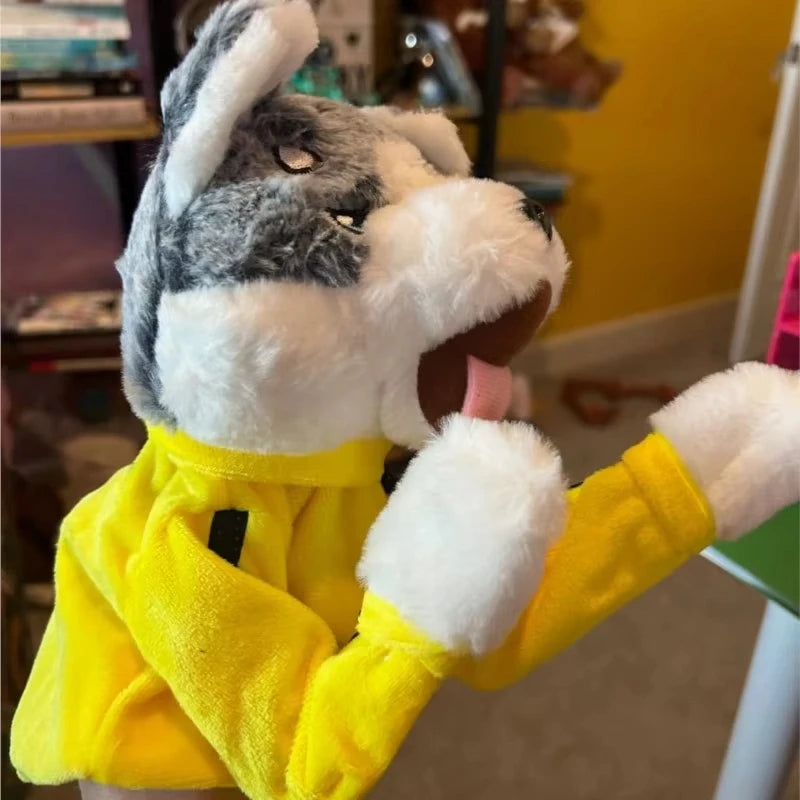 A yellow outfit puppet of a husky with white fur and gray markings is shown in a close-up.