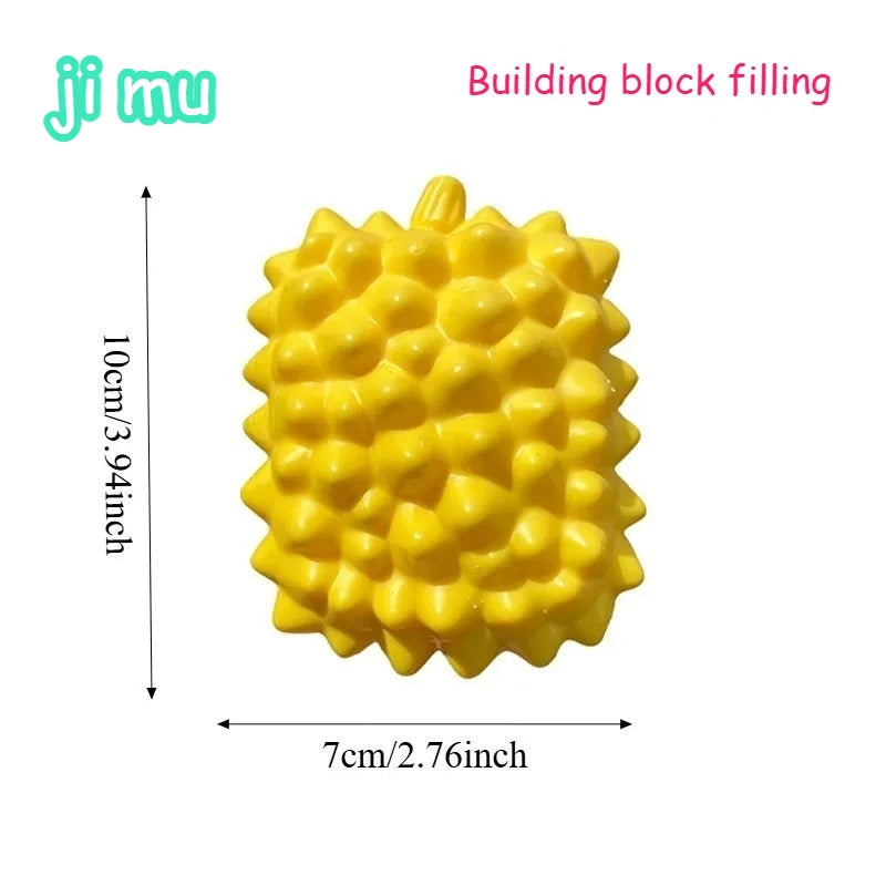 Un bloc de construction jaune vif en forme d'ananas, utilisé comme balle anti-stress ou jouet anti-ennui.