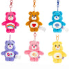 A collection of five colorful Care Bears plush keychains hanging from rings.