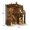 A detailed miniature vintage music room book nook kit featuring wooden architecture and LED lighting.