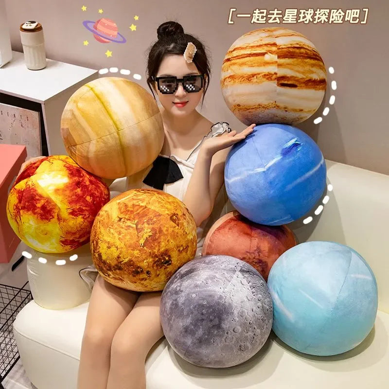 A collection of colorful, spherical plush toys representing planets from the solar system.