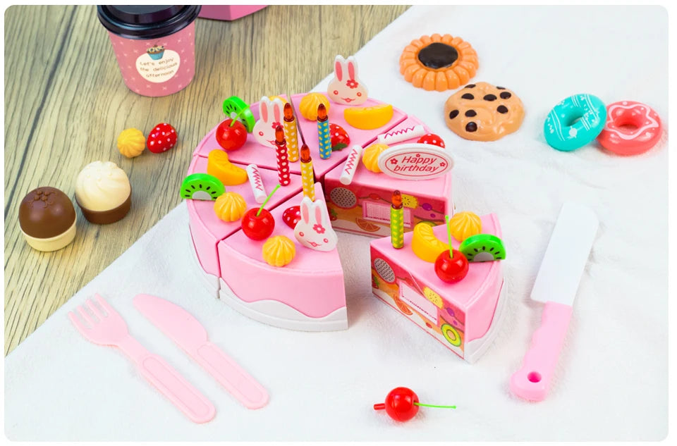 A pink pretend play tea party set featuring food items like cakes, fruits, and pastries for children.