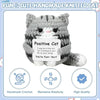 A handmade knitted gray cat figurine with white accents, designed as a cheerful emotional support gift.