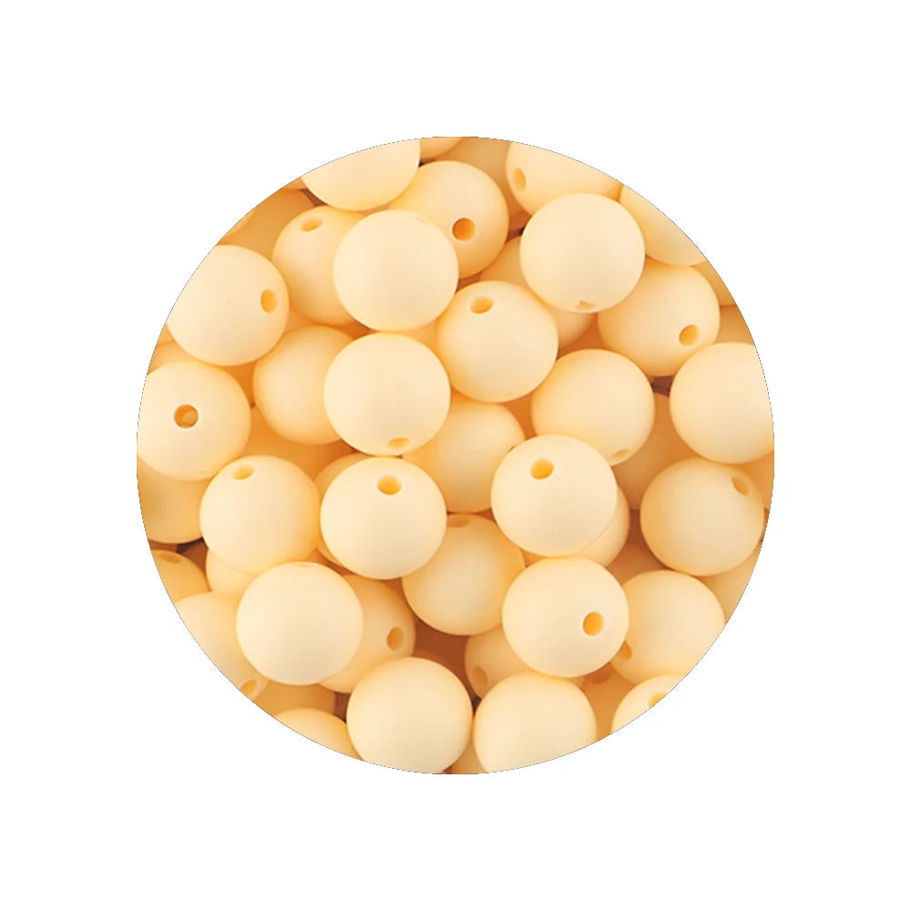 A pile of assorted light beige silicone beads for DIY jewelry making